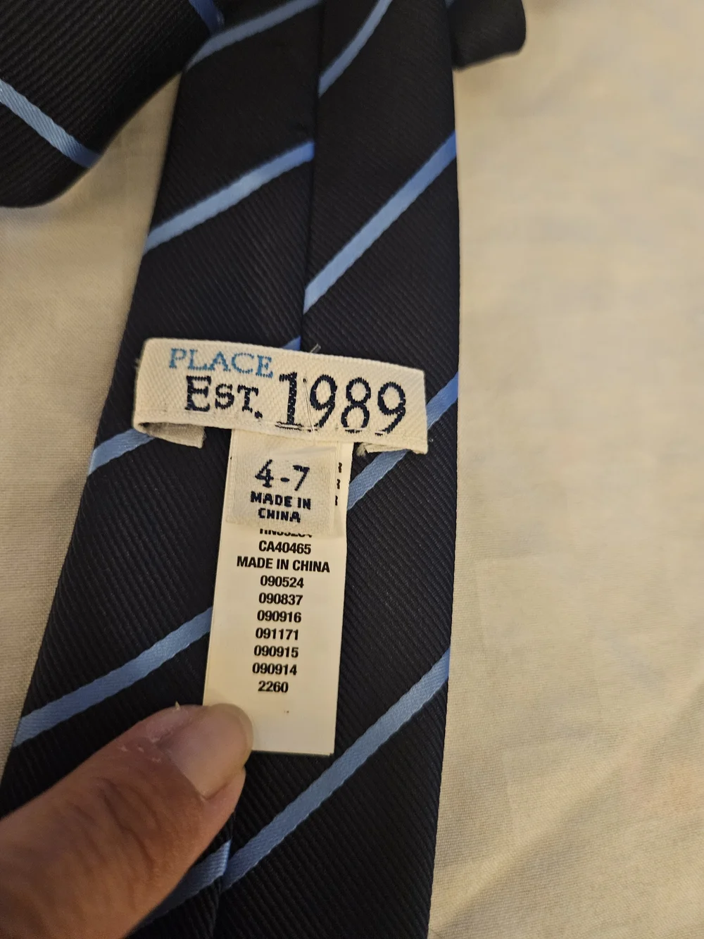 Place Black Necktie with Blue Diagonal Stripes